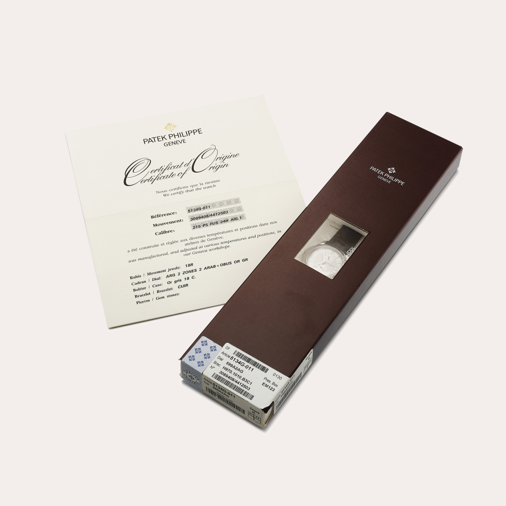 Patek Philippe Reference 5134 | A white gold dual time zone wristwatch with 24 hour indication, In double factory seal, Circa 2008 | 百達翡麗 | 型號5134 | 白金兩地時間腕錶，備24小時顯示，原廠未開封，約2008年製