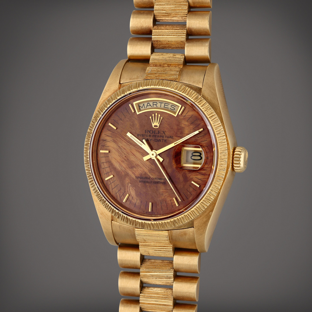 Reference 18078 Day-Date ‘Birch’ | A yellow gold automatic wristwatch with day, date, wood dial, and bark bezel and bracelet, Circa 1979