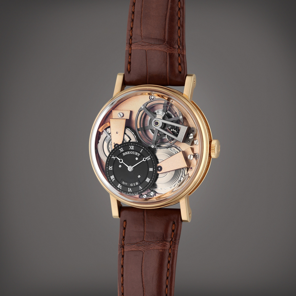 Breguet Reference 7047 Tradition | A pink gold semi-skeletonized wristwatch with chain and fusée, silicon balance spring and power reserve indication, Circa 2022