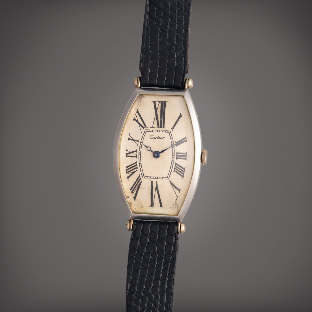Cartier Tonneau | An early platinum and gold tonneau shaped wristwatch, Owned by Al Jolson and Gifted to Dr. Leo Winter, Circa 1920