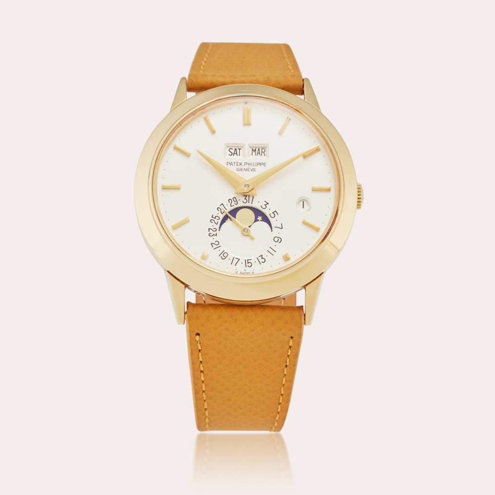Patek Philippe Reference 3450 'Padellone' | A yellow gold perpetual calendar wristwatch with moon phases and leap year indication, Made in 1984