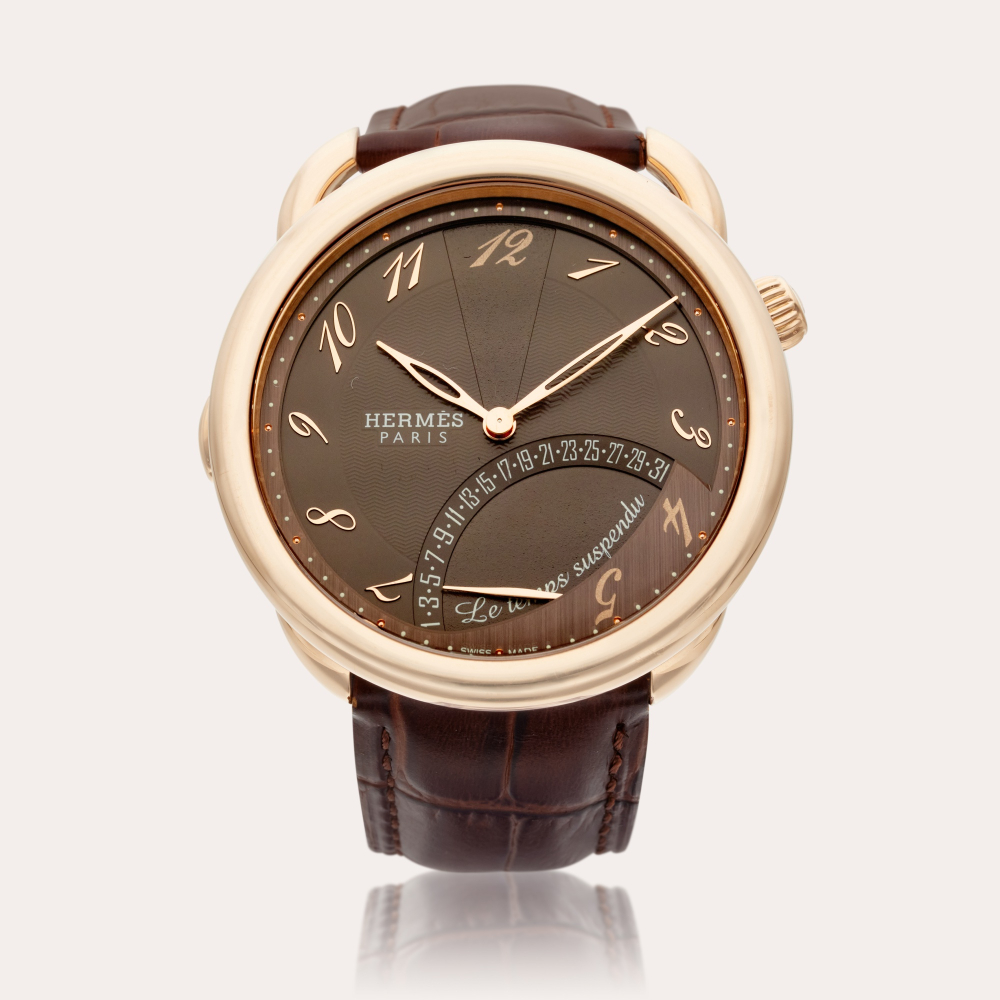 Hermès Reference AR8.97A Arceau Le Temps Suspendu | A pink gold automatic wristwatch with retrograde date, Circa 2015
